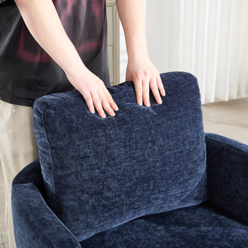 Hands pressing the navy chair's rectangular back cushion