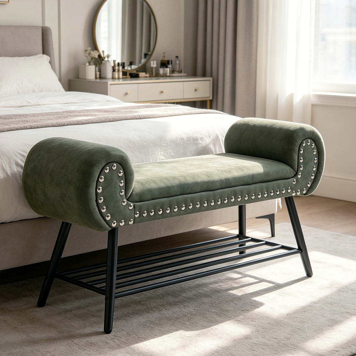 Green rolled arm upholstered shoe bench with a black metal rack and silver tone nailheads