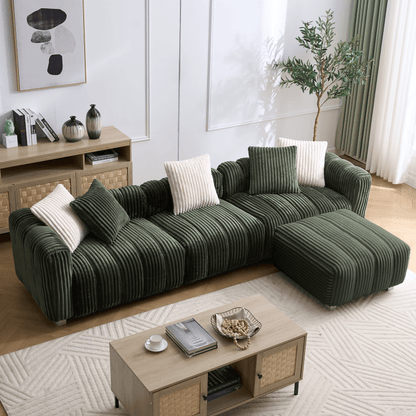 Green ribbed sectional sofa with matching footrest in a bright living room