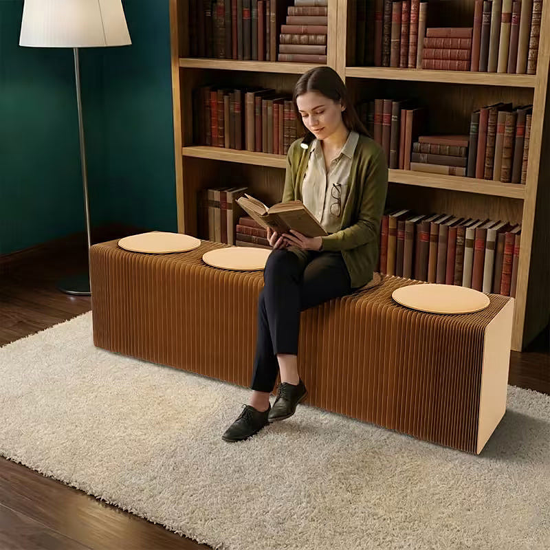 Expandable kraft paper accordion bench with round seat pads — expanded straight configuration