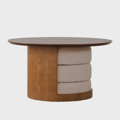 Round brown coffee table with three cream stools stacked inside its curved base