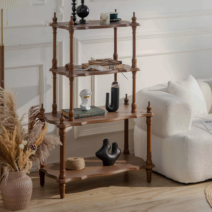 Brown four-tier display shelf with shaped edges and turned posts beside a cream sofa