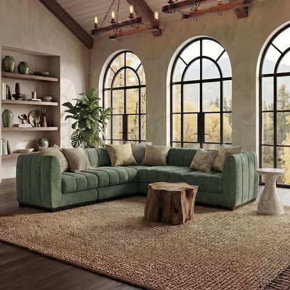 Green Morden Fort L-shaped sectional with channel detailing, broad arms and cushions in a living room.