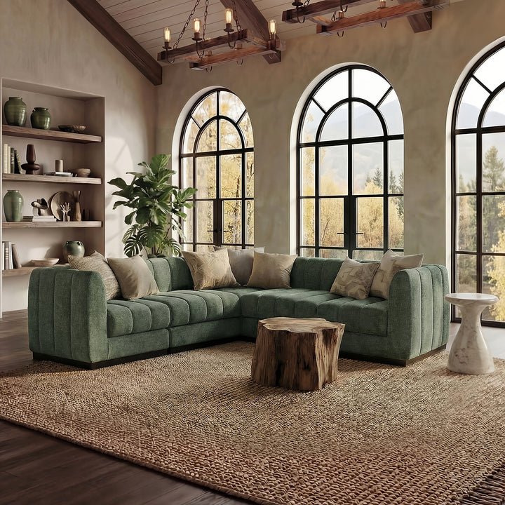 Green Morden Fort L-shaped sectional with channel detailing, broad arms and cushions in a living room.