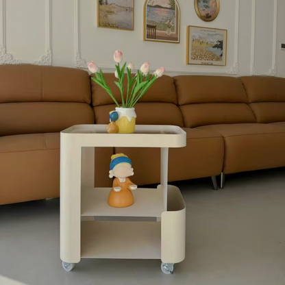 Front view of cream rolling side table with lower shelves