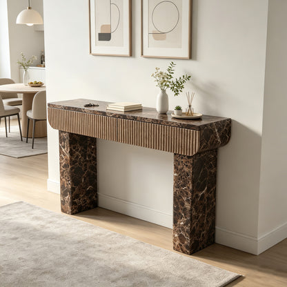 Two-drawer marble-look console styled in a bright neutral interior.