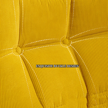 Close-up of the yellow chair's tufted button and stitched upholstery panels