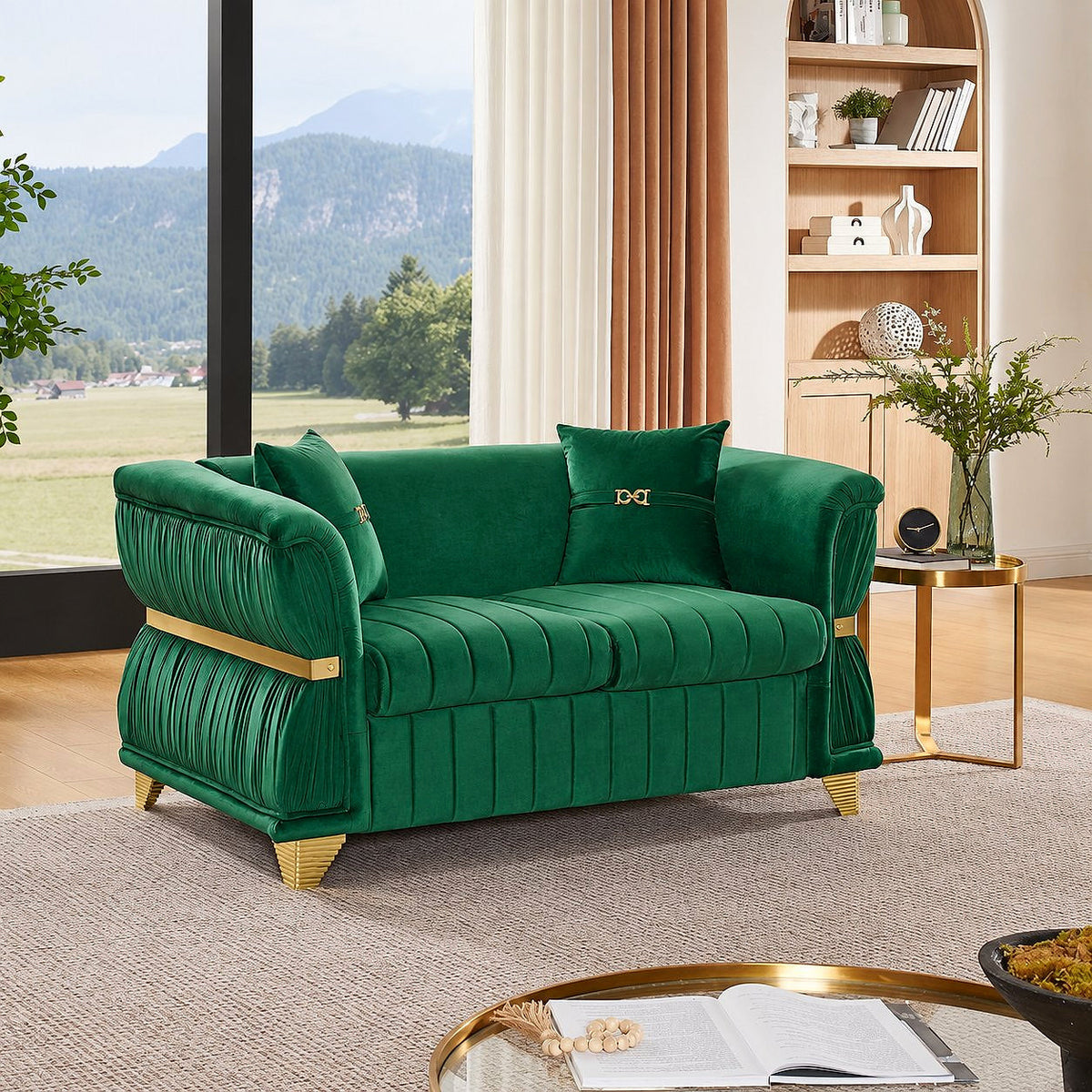 Emerald green velvet loveseat with gold-tone trim and two pillows in a bright room