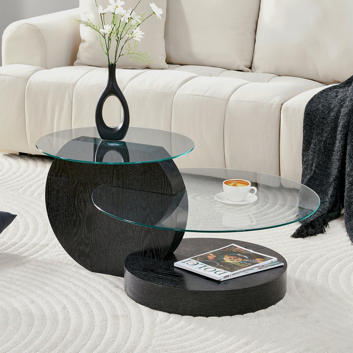 Black glass table beside sofa