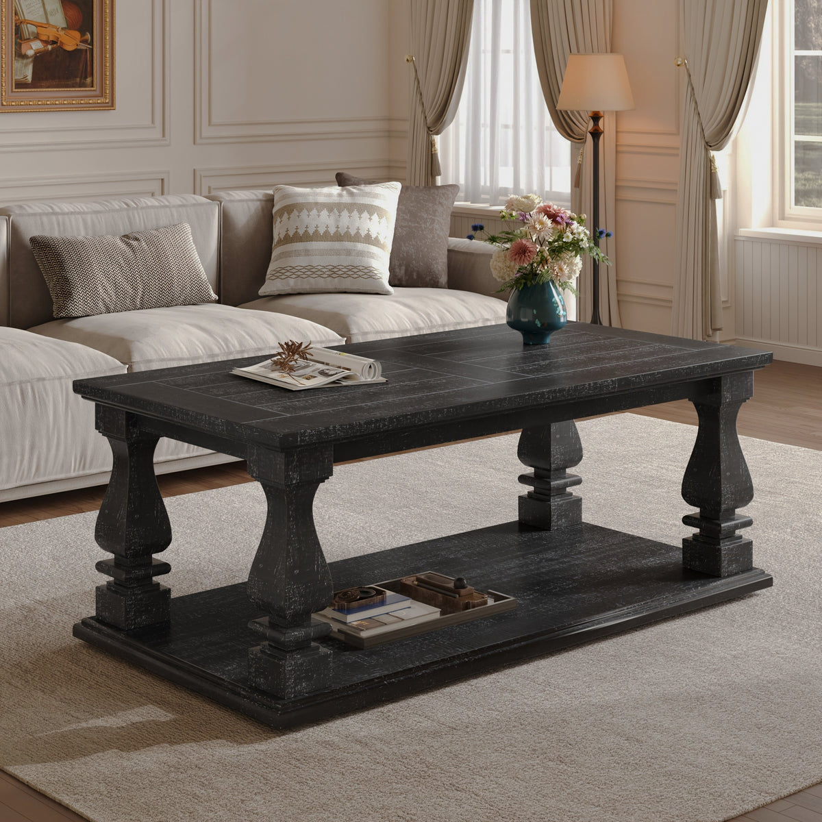 Black farmhouse coffee table with storage shelf in front of a gray sofa