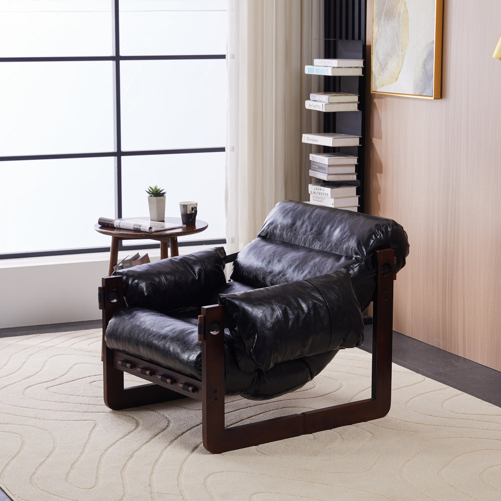 Antique Black Wood-Frame Lounge Chair — antique Black side three-quarter view in a study