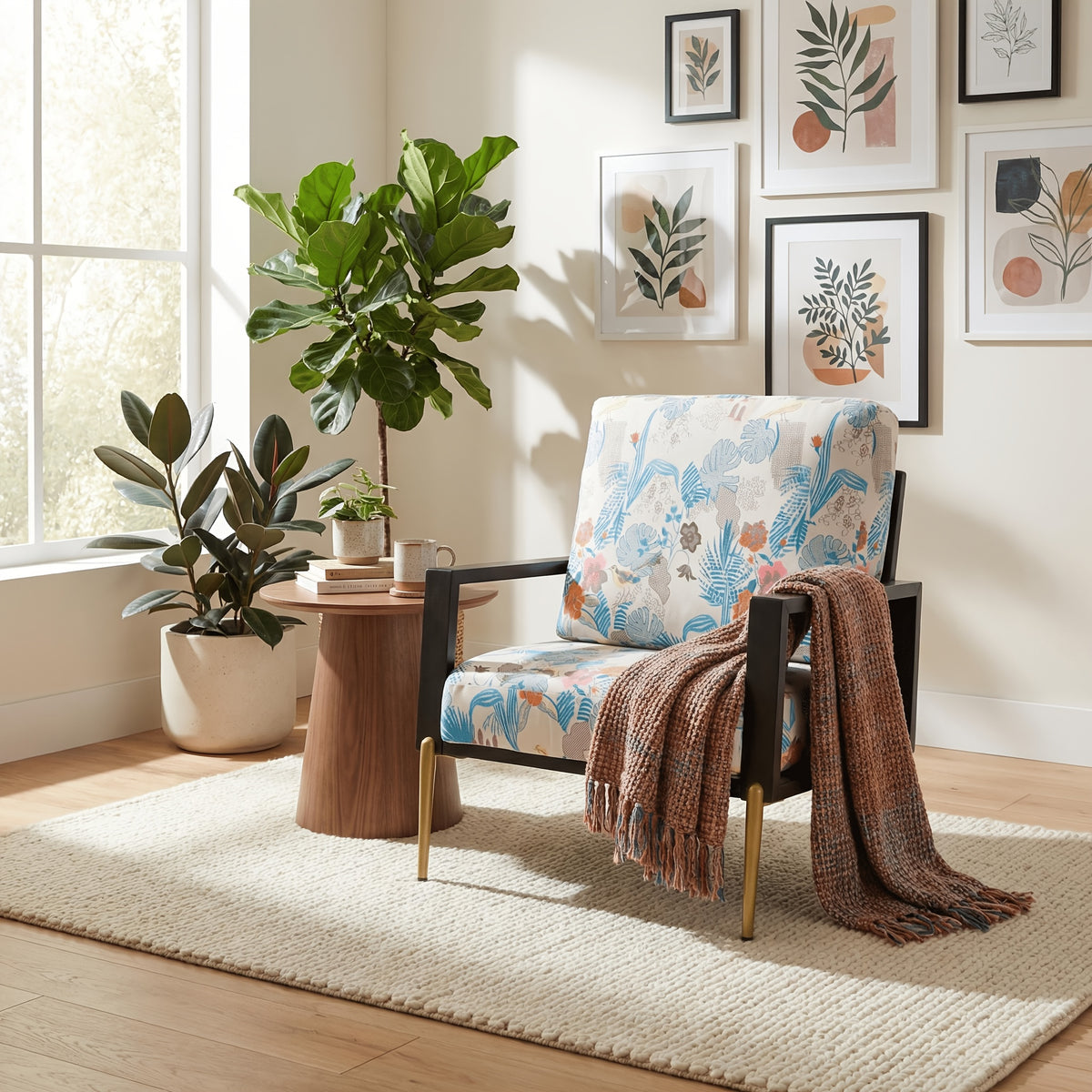 Blue and Orange Floral Velvet Accent Chair — floral chair beside a table with a throw on the arm