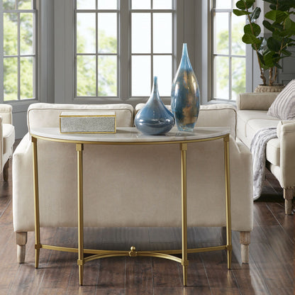 Madison Park Signature Bordeaux console with white half-moon top and gold legs behind a sofa