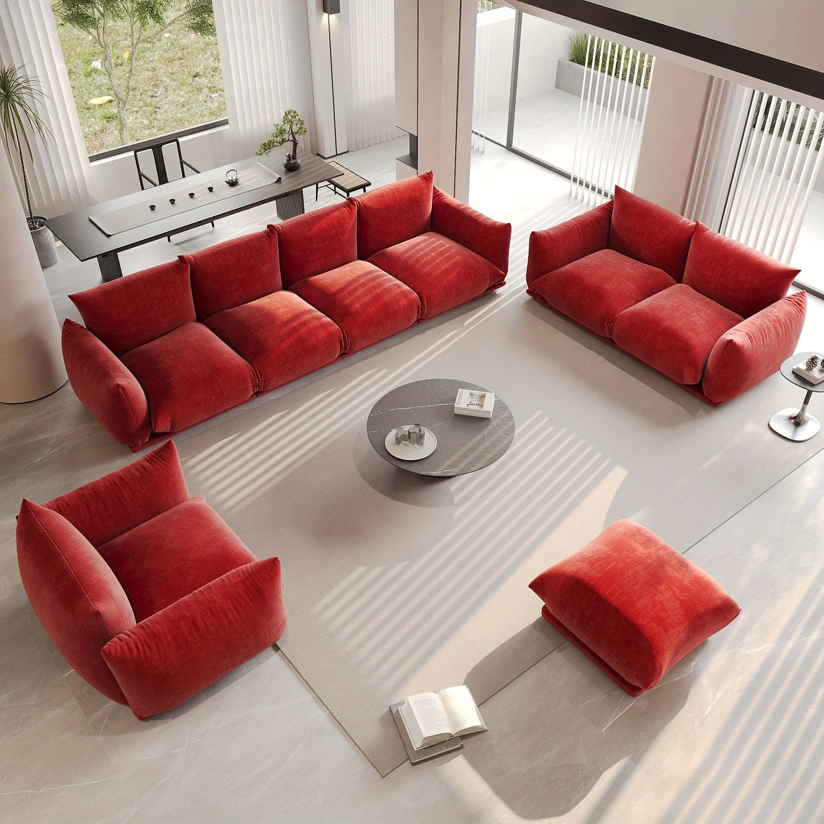 Red-orange modular seating arranged as a sofa, loveseat, chair and ottoman in a bright living room