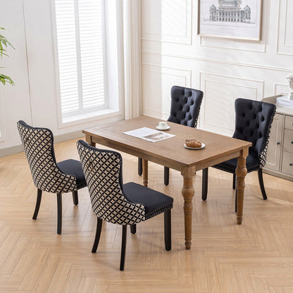 Black velvet dining chair with a patterned back and dark wood legs