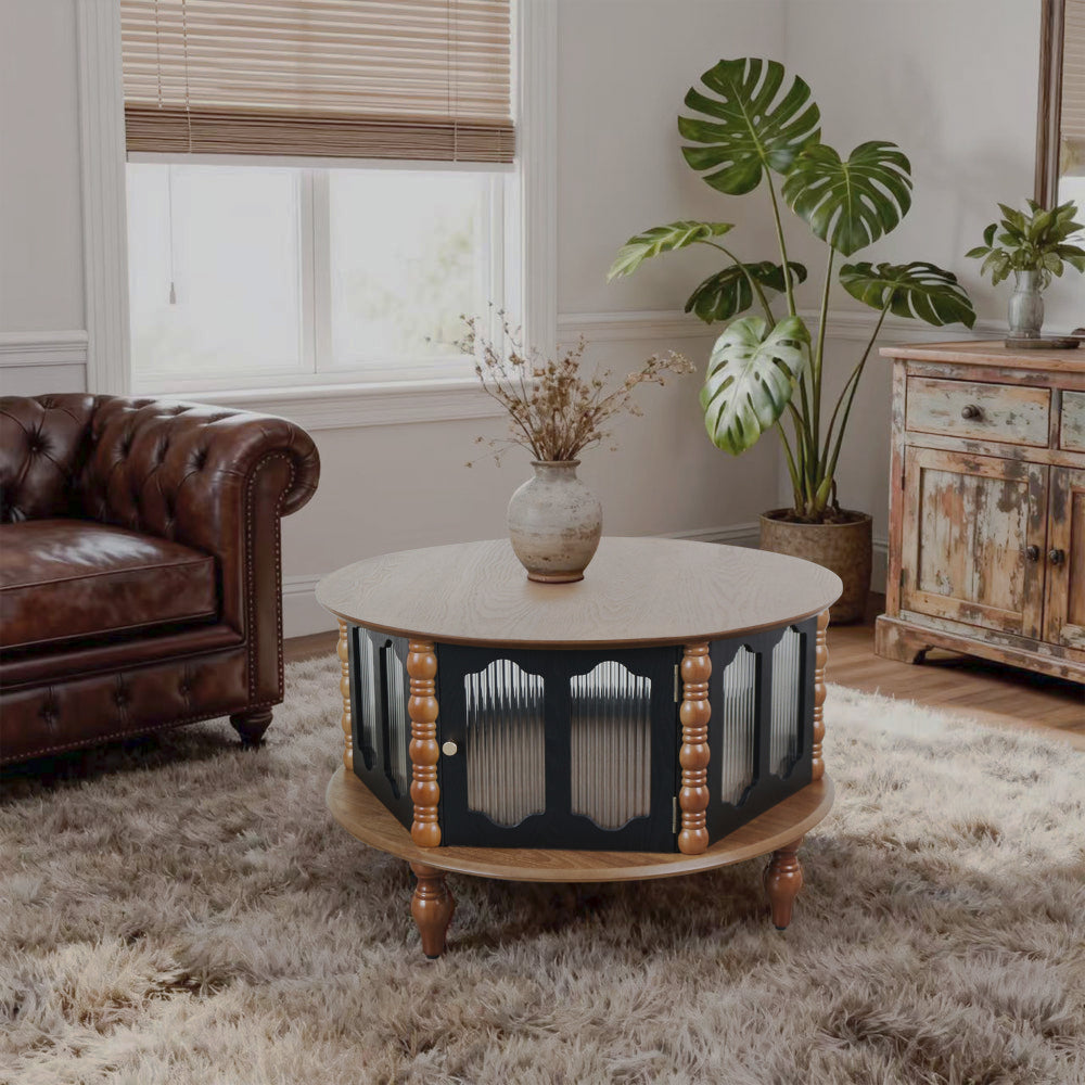Round three-door coffee table with ribbed panels and turned legs beside a brown sofa