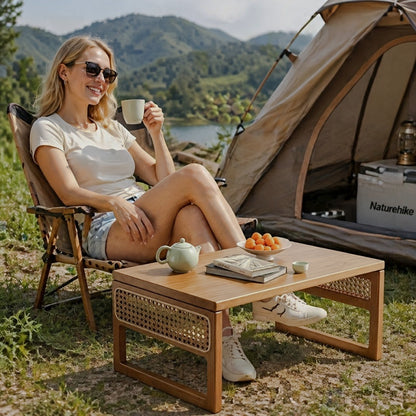 Walnut-tone folding table beside a camping chair