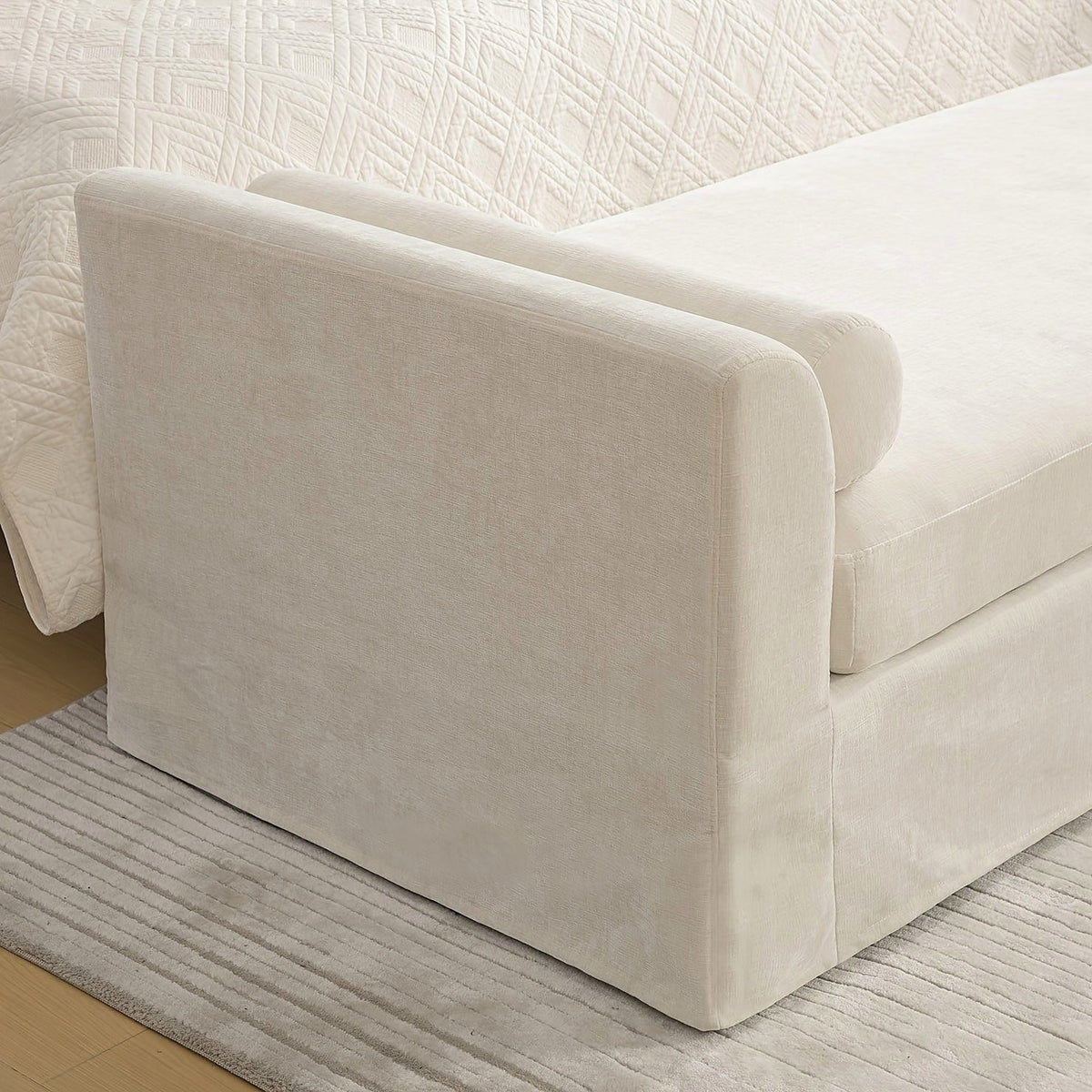 Side profile of the wide chenille bench with upholstered end panels