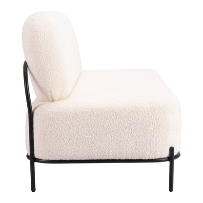 Side view of the vanilla armless sofa showing the deep seat, rounded back cushion and black steel legs.