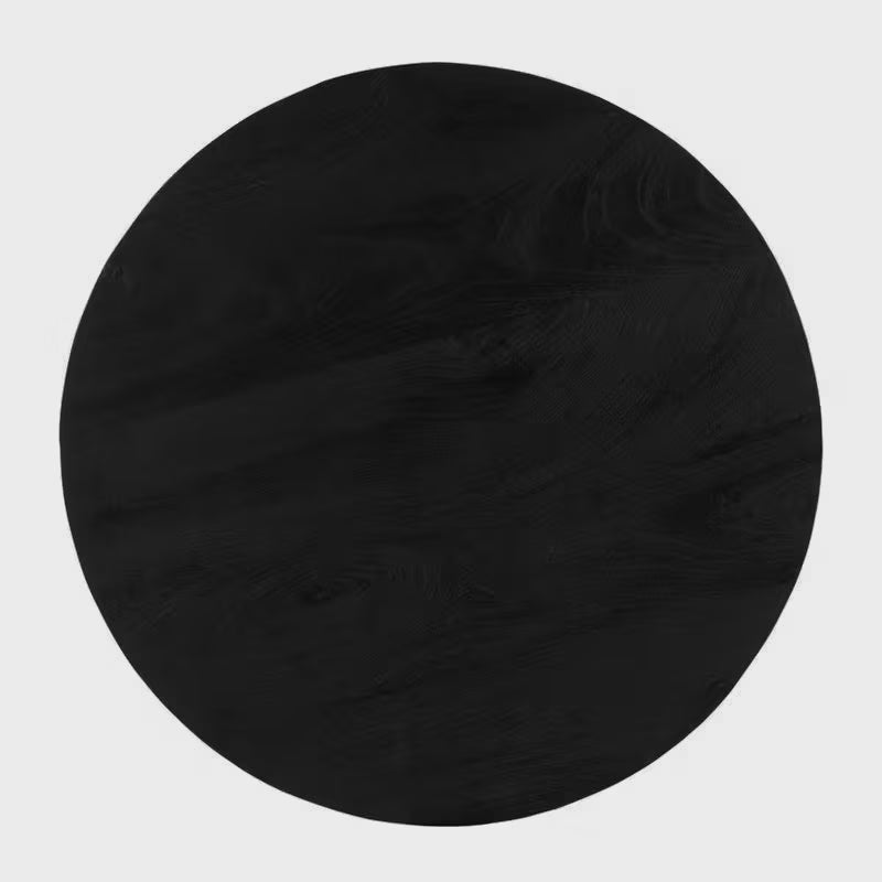 Overhead view of the round black dining tabletop