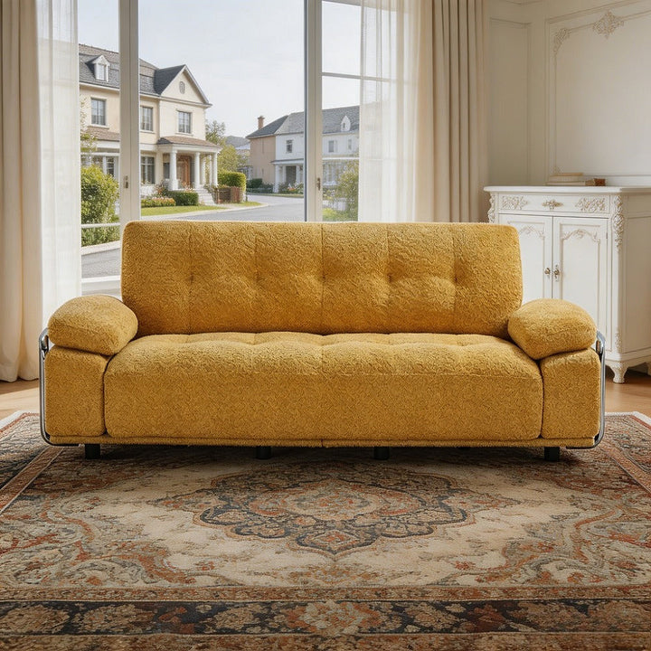 Alden yellow tufted sofa, front view in a living room