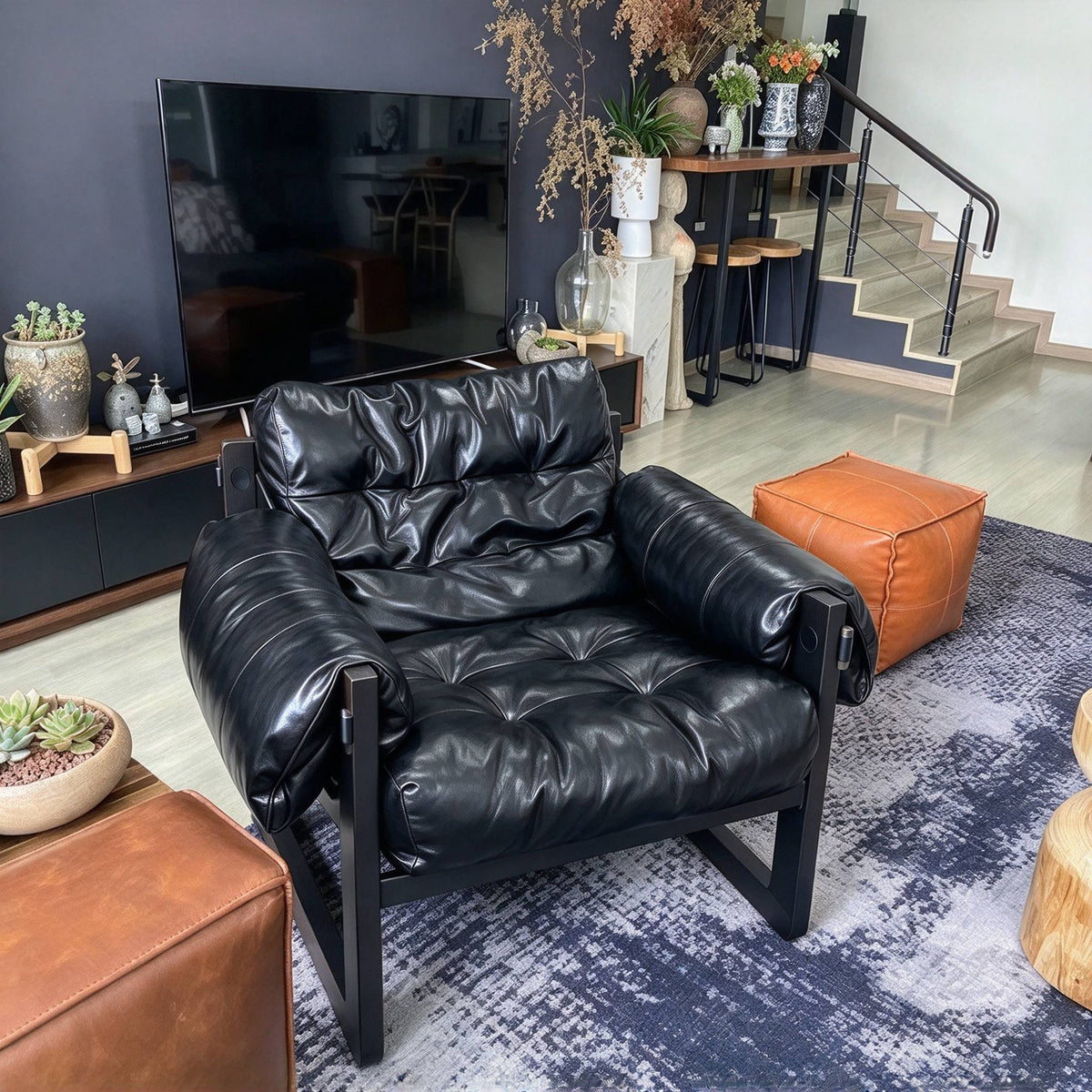 Padded Sling Lounge Chair — black front three-quarter view in a living room