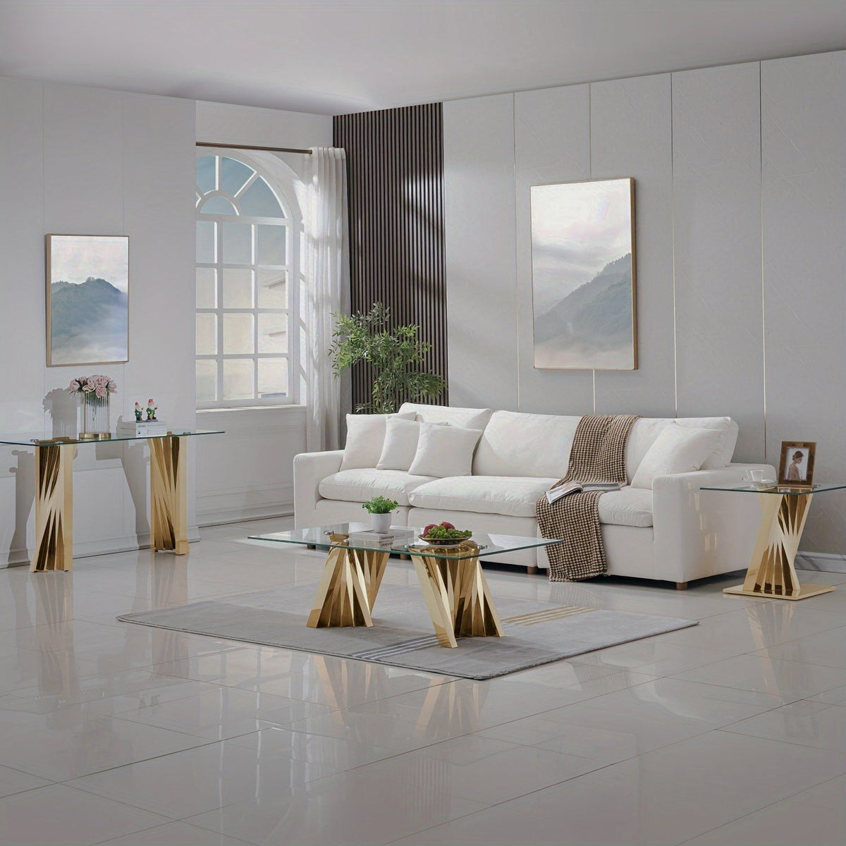 Glass coffee table, end table and console with twisted gold-tone bases in a white living room