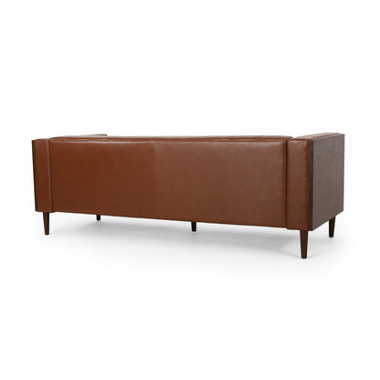 Cognac Button-Tufted Sofa with Bolster Pillows — rear three-quarter view.