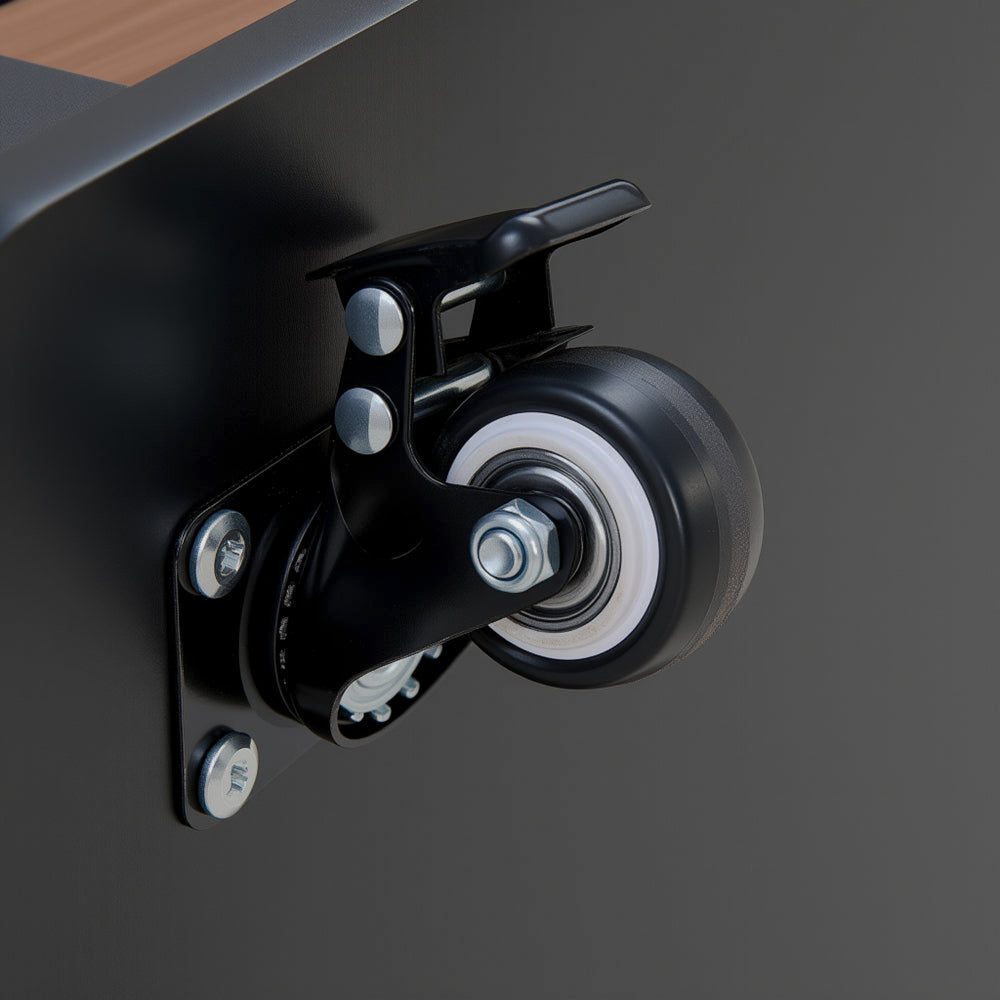 Close-up of black caster wheel on storage table