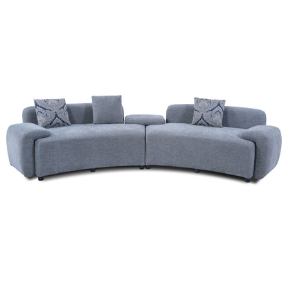 Blue-Grey Curved Sofa with Damask Pillows — front product view on white.
