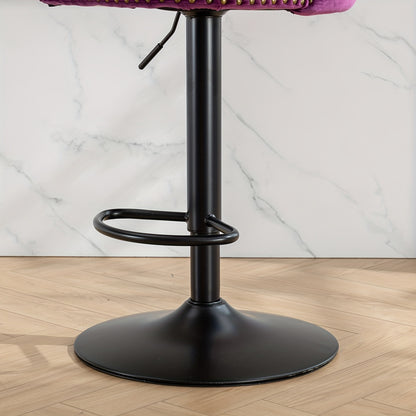 Close-up of the stool's black pedestal base, foot ring and adjustment lever