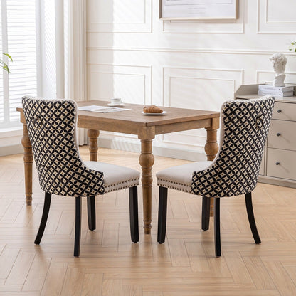Beige velvet dining chair with a patterned back and dark wood legs