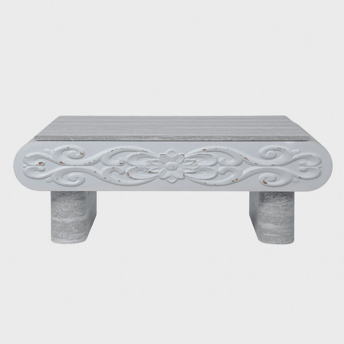 Front view of floral scrollwork on gray coffee table