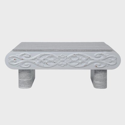 Front view of floral scrollwork on gray coffee table