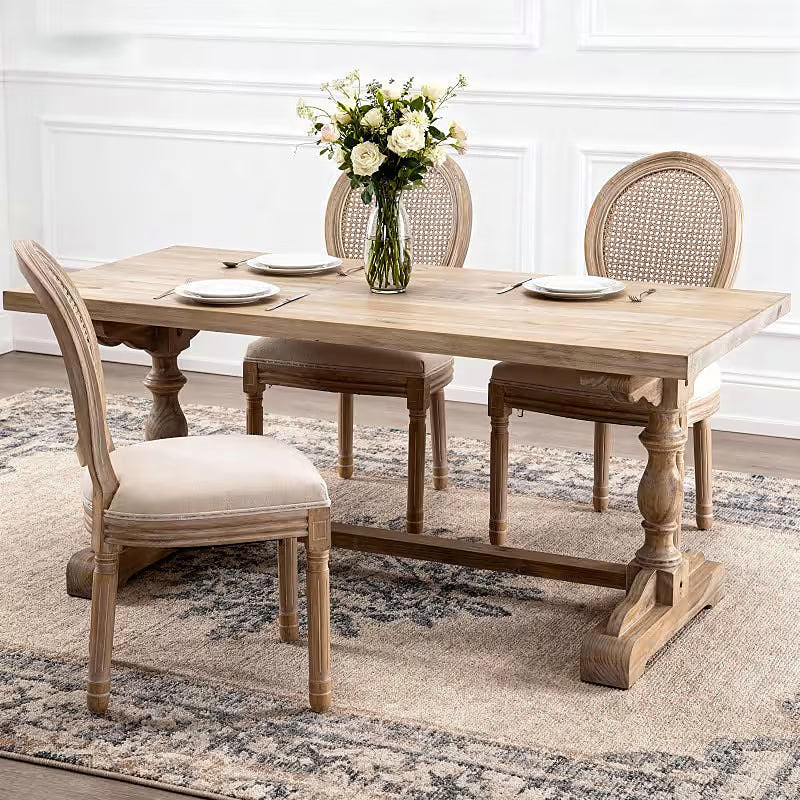 French style dining chair with a woven rattan back and beige upholstered seat