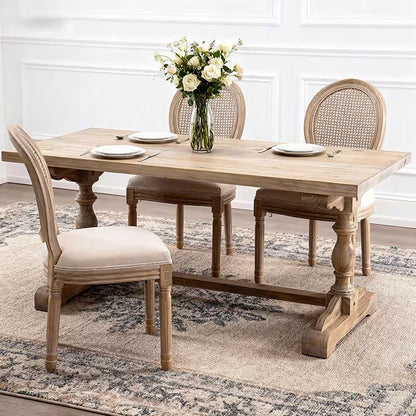 French style dining chair with a woven rattan back and beige upholstered seat