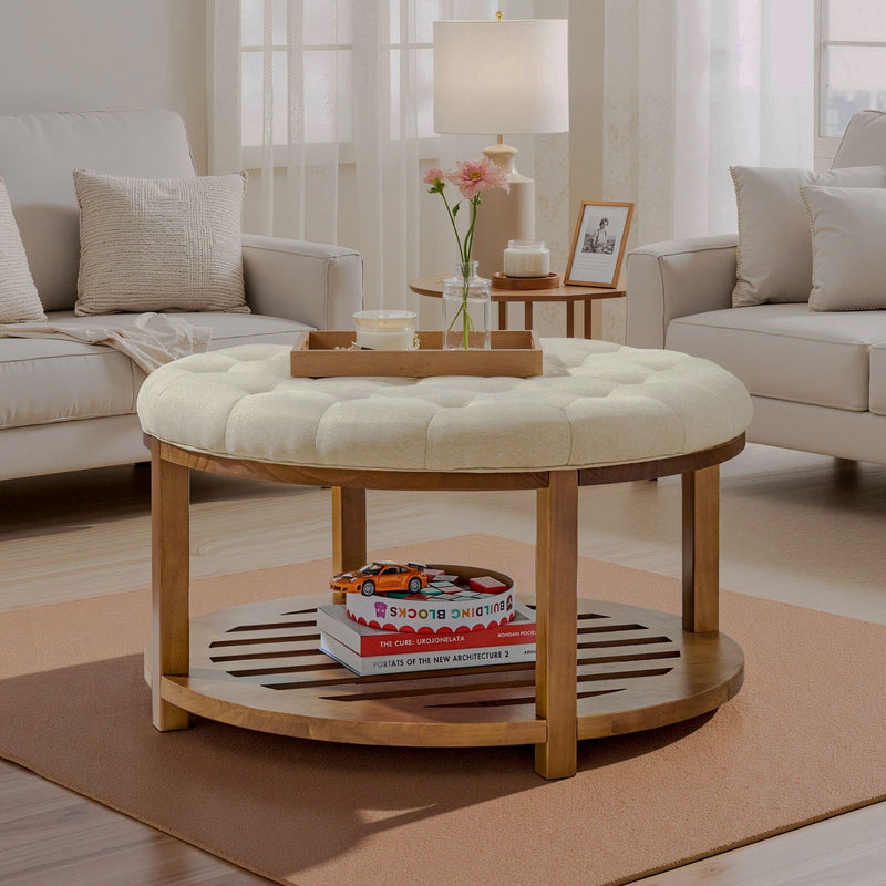 Round ivory tufted ottoman coffee table with wood shelf in living room