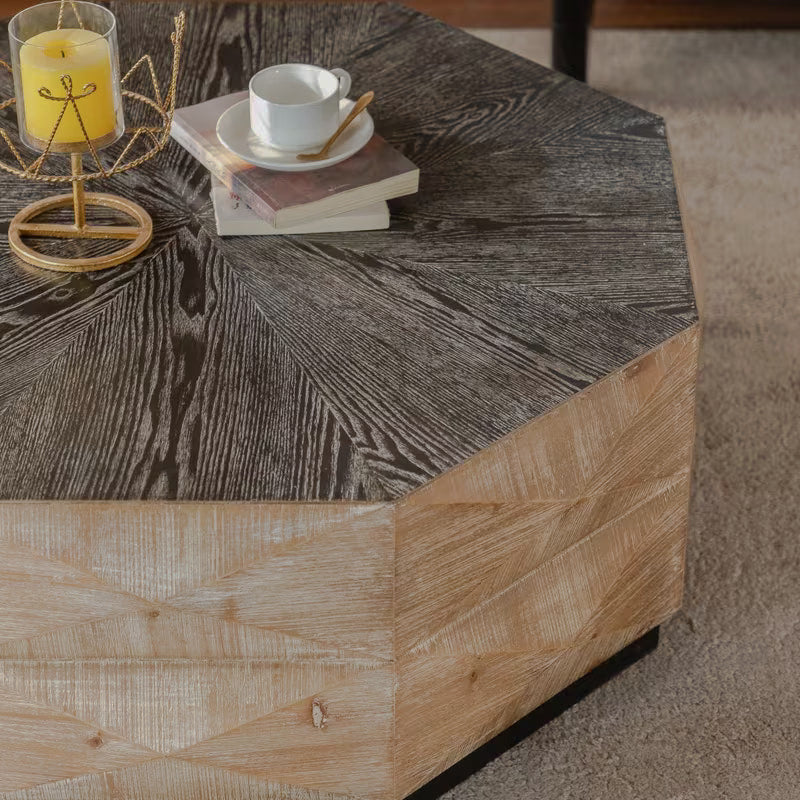 Close-up of an octagonal coffee table's dark top and light faceted side panels