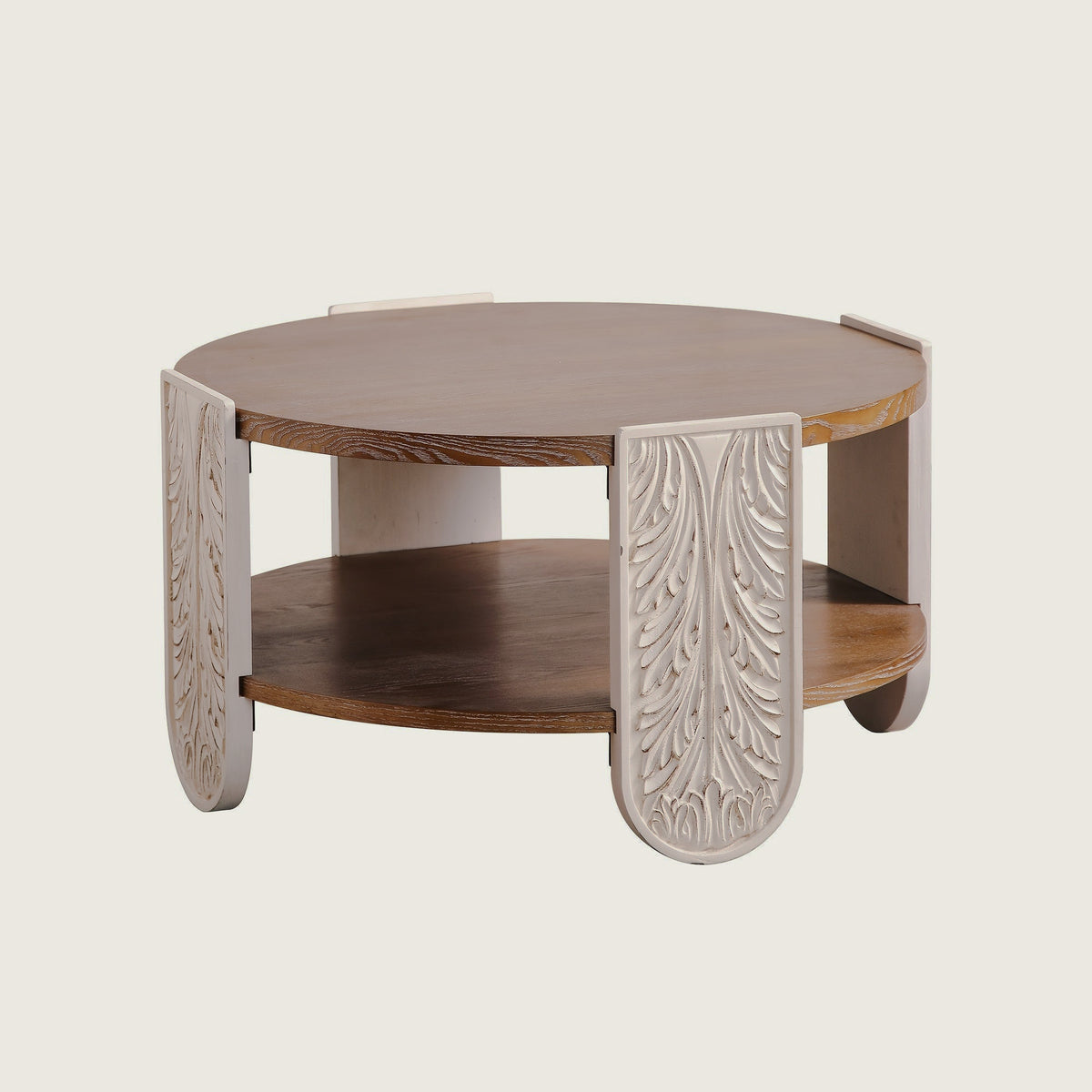 Round two-tier carved-leg coffee table isolated on white