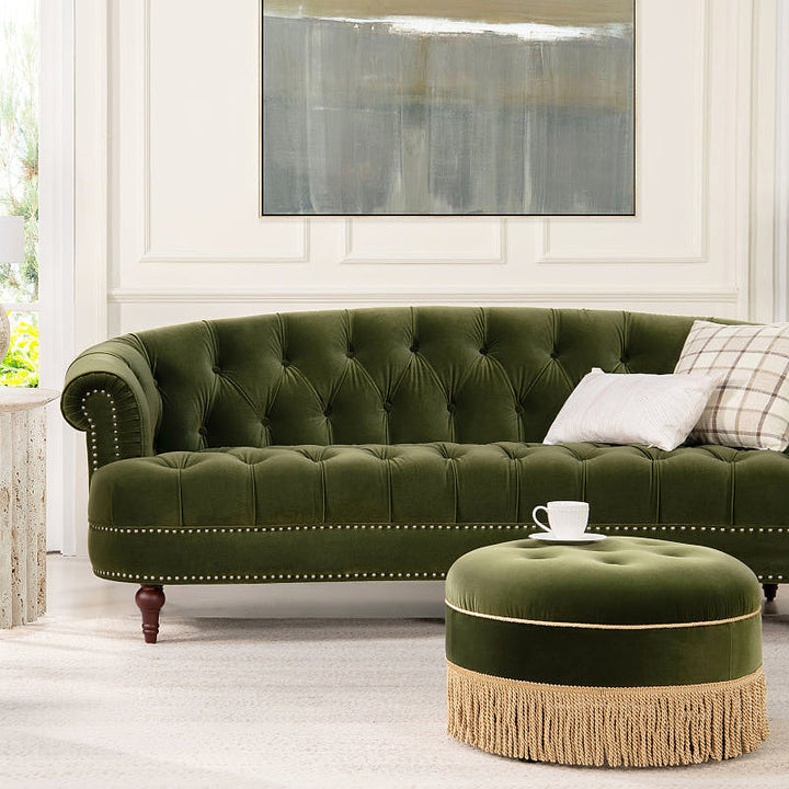 La Rosa Olive Green Velvet Chesterfield Sofa — styled with an ottoman shown as a room accessory