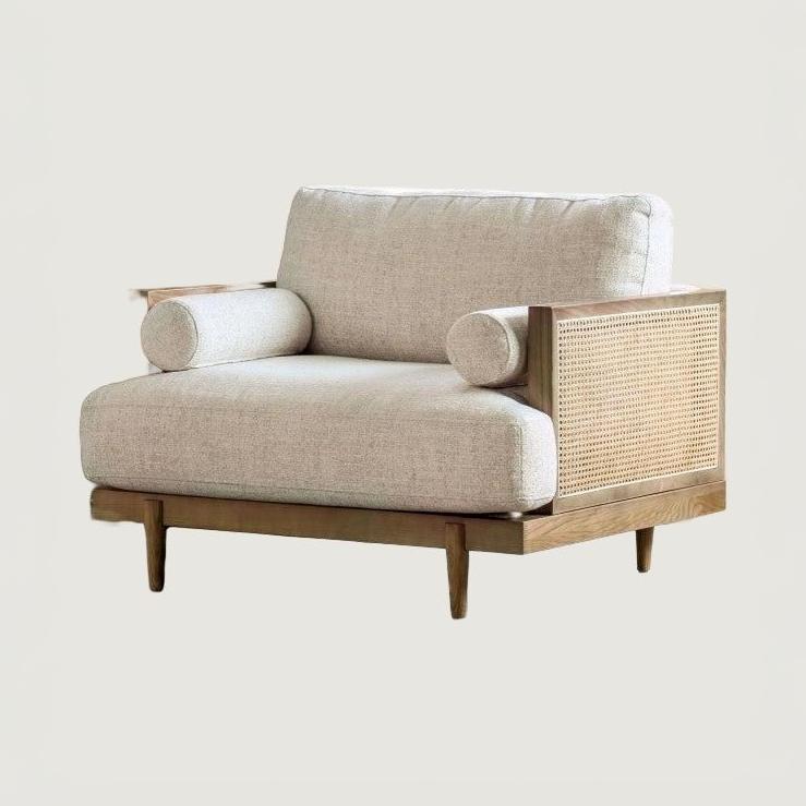 Beige Cane-Side Accent Chair with Bolster Cushions — complete product in an uncropped square photograph