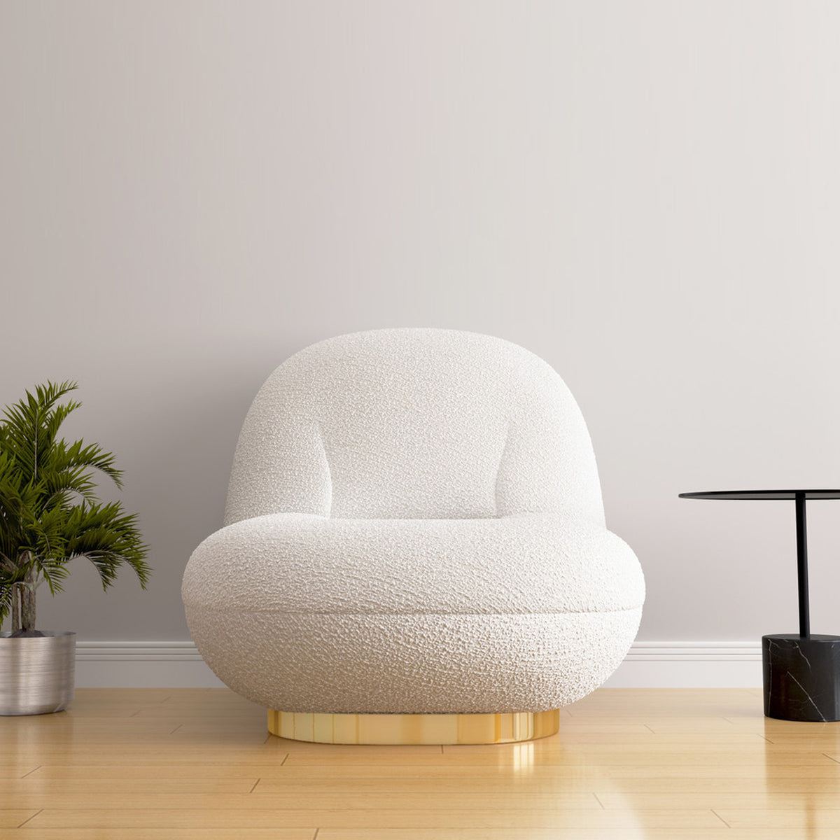 Gold-base boucle Breeze chair beside table