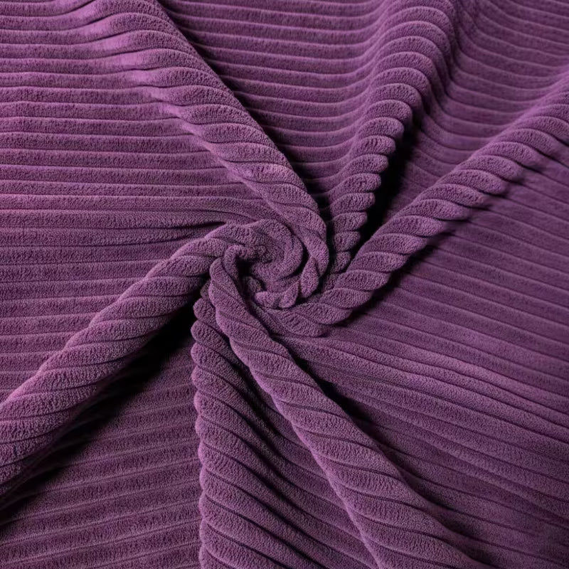 Close-up of purple corduroy fabric