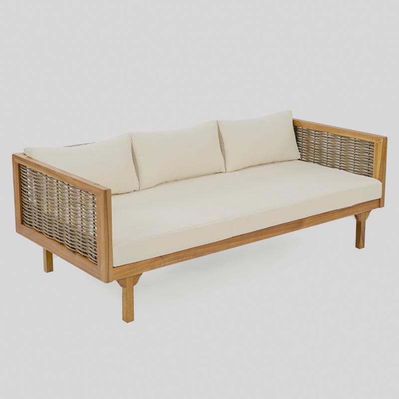 Angled studio view of the patio sofa with beige cushions and woven side panels