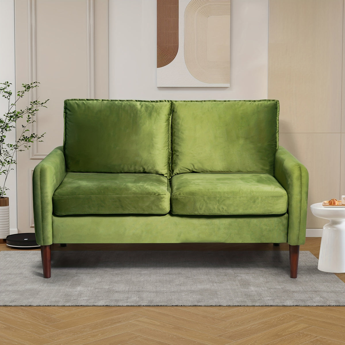 Bilhilury Velvet Loveseat — green velvet loveseat in a living room.