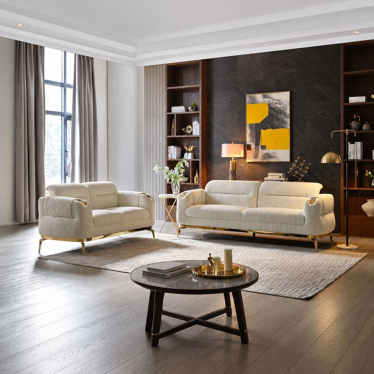 Cream Zoe sofa and loveseat with gold legs in a living room