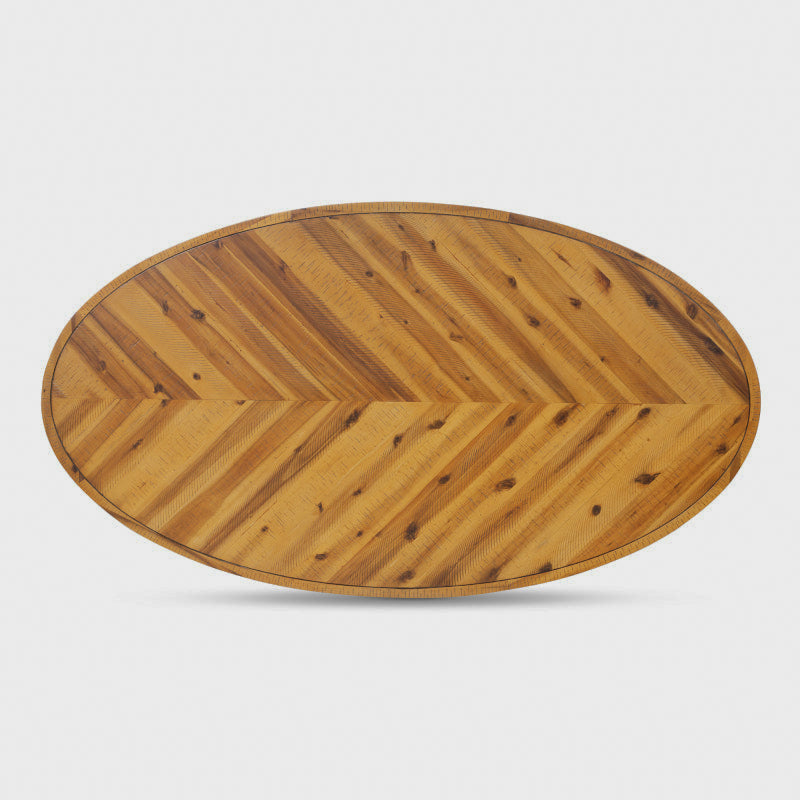 Overhead view of the coffee table's oval herringbone-pattern top