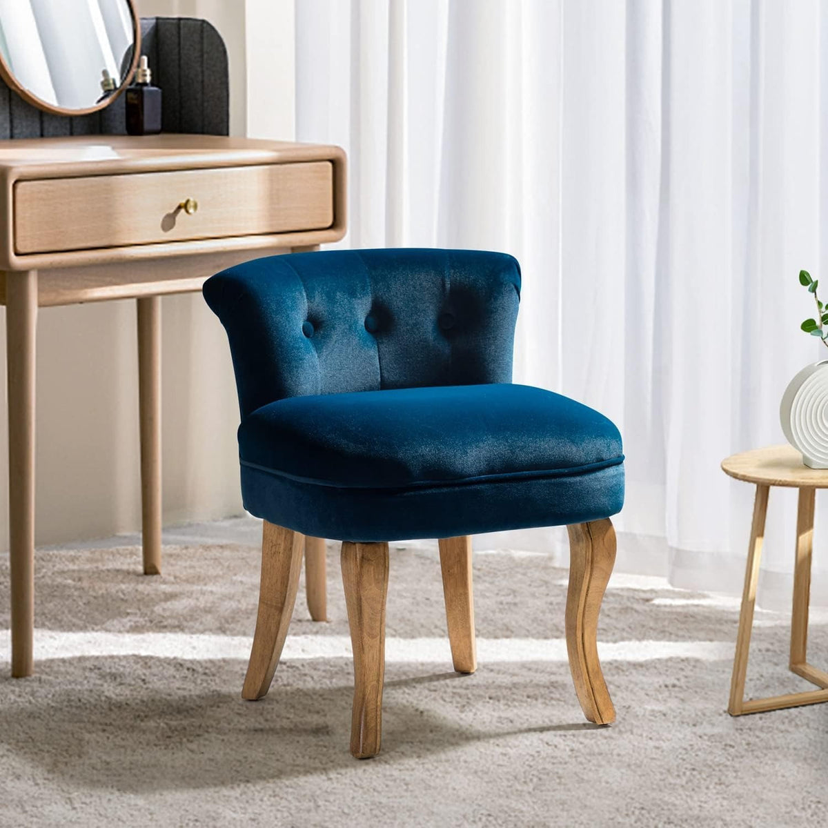 Front angled view of the navy low-back vanity chair