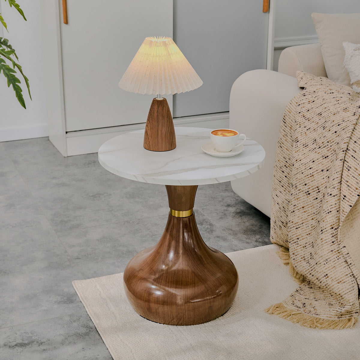 Small pedestal table by sofa