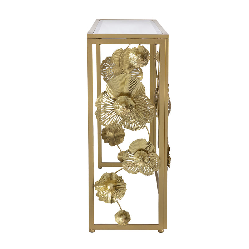 Side view of the gold-tone console showing sculptural flowers within the frame.